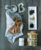 A loaf of bread, canned bread and various spices