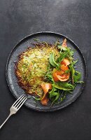 Asparagus and potato rosti with smoked salmon, lime and honey dressing and rocket