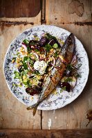Roasted mackerel on bulgur with beetroot and onion (seen from above)