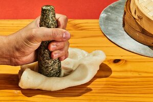 Rice flour dough being flattened (Korea)