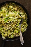 Fried spring cabbage in a cast iron pan