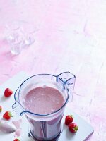 Strawberry Dream with banana, chia seeds and coconut milk in a mixer