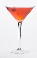 A Cosmo cocktail in a stemmed glass