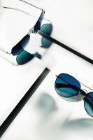 Calvin Klein aviator sunglasses with a silver frame