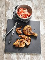 Piri piri chicken with tomato and onion salad