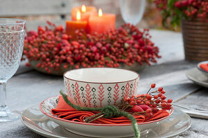 Rosehip table decoration on the autumn terrace