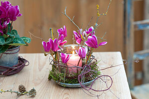 Preserving jar used as a lantern, decorated with flowers