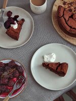 Flourless chocolate cake with wine-roasted winter blackberries with bayleaf