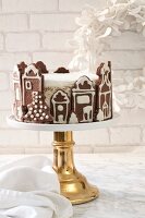 Layered cake in a gingerbread house for Christmas