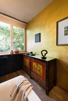 Antique sideboard in bathroom