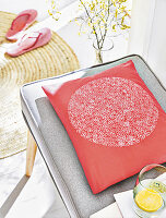 A homemade cushion cover with a stamped pattern