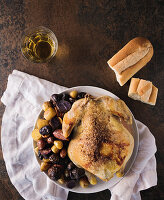 Roast chicken with potatoes, bread and white wine