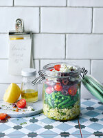 Greek kritharaki salad with beans, tomatoes, olives and feta cheese