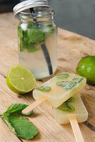 Mojito ice lollies on a wooden surface