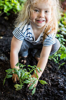 A little girl gardening