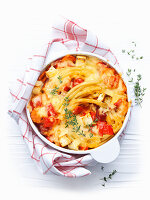 Pasta casserole with tomatoes, cheese and thyme