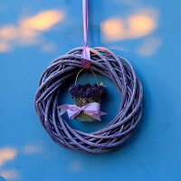 Posy of lavender in centre of suspended wreath