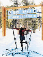 A young woman in the snow wearing a checked jacket and a skirt with skis