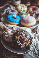 Sweet chocolate donuts served in the plate, selective focus