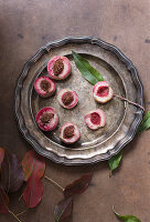 Fresh peaches on a pewter plate