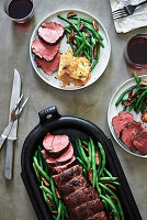 Beef fillet with potato gratin, green beans and mushrooms