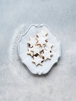 Shortbread biscuits with powdered sugar on a vintage plate