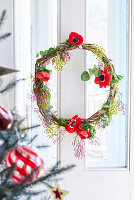 Christmas door wreath with red anemone flowers