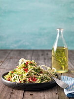 Kohlrabi pasta with pomegranate seeds and pea and almond sauce