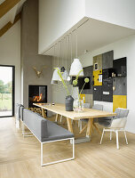 Dining room in shades and grey and white with many wooden elements in architect-designed house