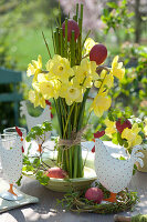 A bouquet of daffodils in a bowl