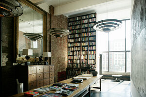 Dark living room in old industrial building with glass wall