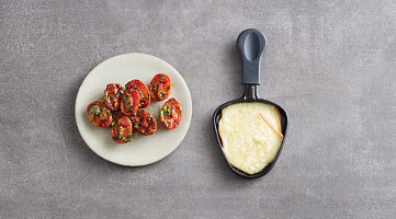 Grilled, marinated tomatoes made in a raclette