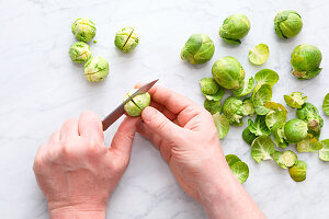 Brussels sprouts being scored