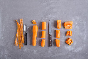 Carrots being peeled and diced