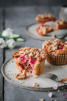 Rhubarb muffins with almonds and streusel topping