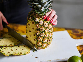 Peeling a pineapple