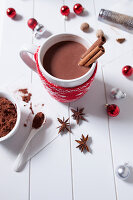 Hot chocolate with cinnamon sticks in a Christmas mug
