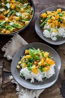 Vegetarian pumpkin and pea curry with rice