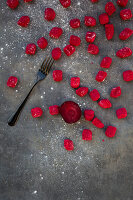 Fresh beetroot gnocchi on a gray background (top view)