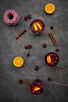 Mulled wine with cranberries, cinnamon, orange slices and star anise