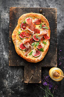 A fig pizza with Parma ham