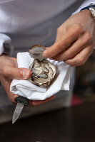 A fresh oyster being opened