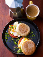 Toastie sandwiches with fried eggs and tomatoes for a late breakfast