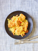 Curried sauerkraut with coconut and chicken nuggets