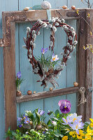 Kitten willow heart with crocuses on old window sash