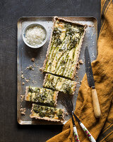 Broccolini and cheese quiche on a baking tray
