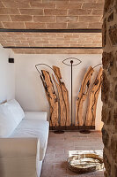 Sculpture of gnarled wood and metal in Mediterranean living room