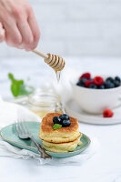 Japanese souffle pancakes with fruits and honey