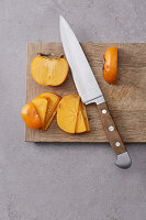 Persimmon being sliced
