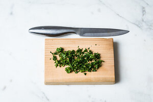 Save a colourless sauce by adding chopped herbs to it